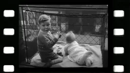 Baby in a Window Cage